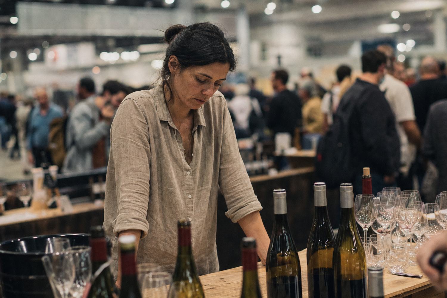 A producer pouring samples for a crowd at a Singapore tasting event