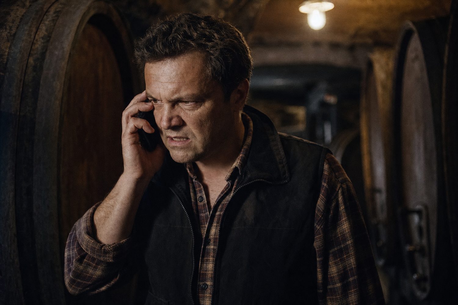 An Alsace winemaker anxiously reviewing a large unsecured order